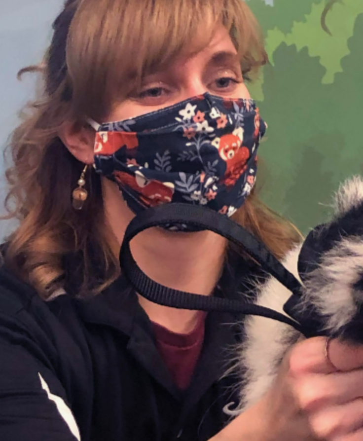 woman holding skunk