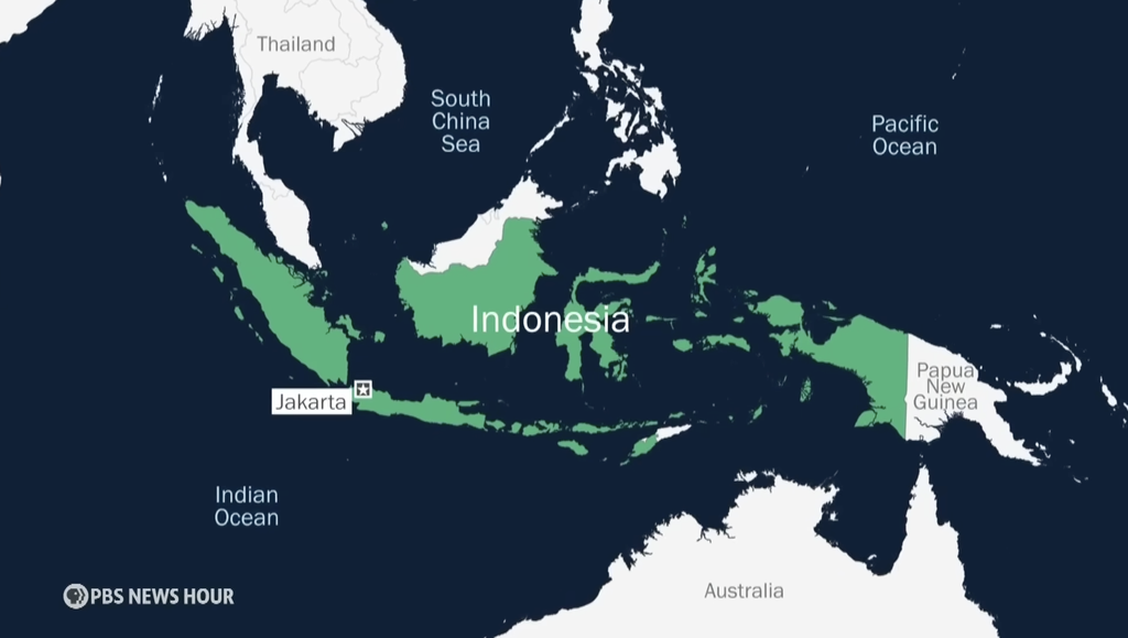 A PBS map of Indonesia highlighted in green with Jakarta's locaiton pointed out in the southwest.